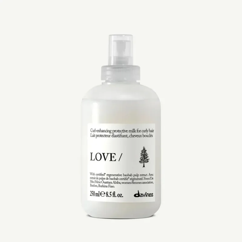 Davines LOVE CURL Enhancing Milk Essential Haircare Живильне молочко з термозахистом для еластичності, контролю та виразної форми локонів 250 мл